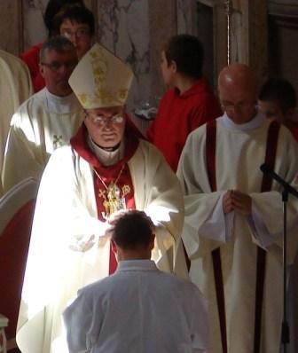 Bishop Philip lays hands on Don to ordain him deacon.